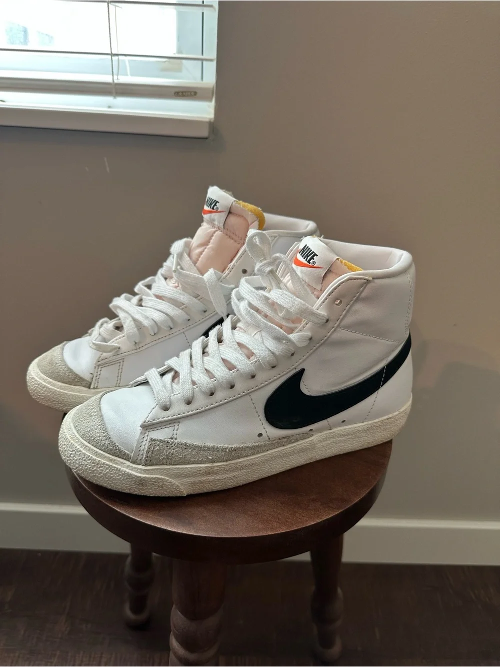 Nike White High-Top Sneakers with Black Swoosh and Pink Tongue